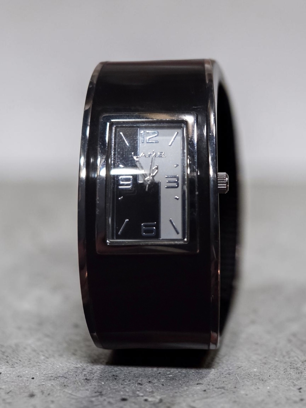 L.A.M.B. Black Bangle Watch with Silver Dial